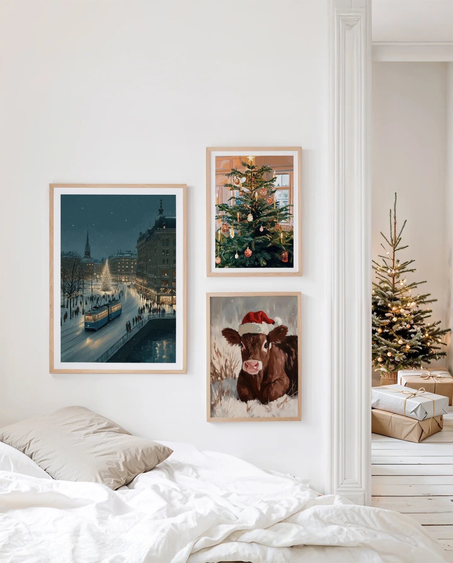 A bedroom with a gallery wall of framed winter prints above the bed, and a lit tree visible through a doorway